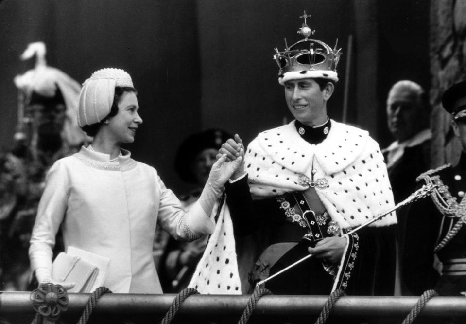 Queen Elizabeth II with her son Charles during his investiture as Prince of Wales on July 1, 1969 in Caernarvon, Wales.<span class="copyright">Arthur Sidey—Daily Mirror/Mirrorpix/Getty Images</span>