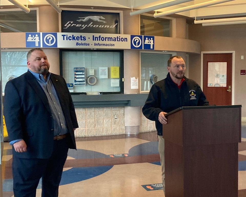 Erie Metropolitan Authority CEO Jeremy Peterson, left, and Erie County Executive Brenton Davis announce an agreement Thursday to temporarily reopen Erie's Greyhound bus ticket office.