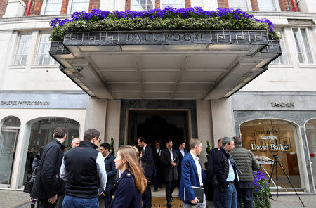 Attendees stand outside Claridge's Hotel after the launch of Uber Technologies' initial public offering (IPO) roadshow at the hotel in central London, Britain April 29, 2019. REUTERS/Toby Melville