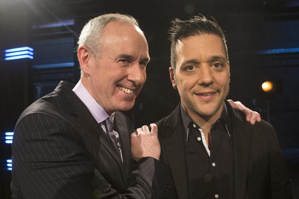 George Stroumboulopoulos, right, is pictured with Ron MacLean as Rogers TV unveil their team for the station&#39;s NHL coverage in Toronto on Monday March 10, 2014. (AP Photo/The Canadian Press, Chris Young)