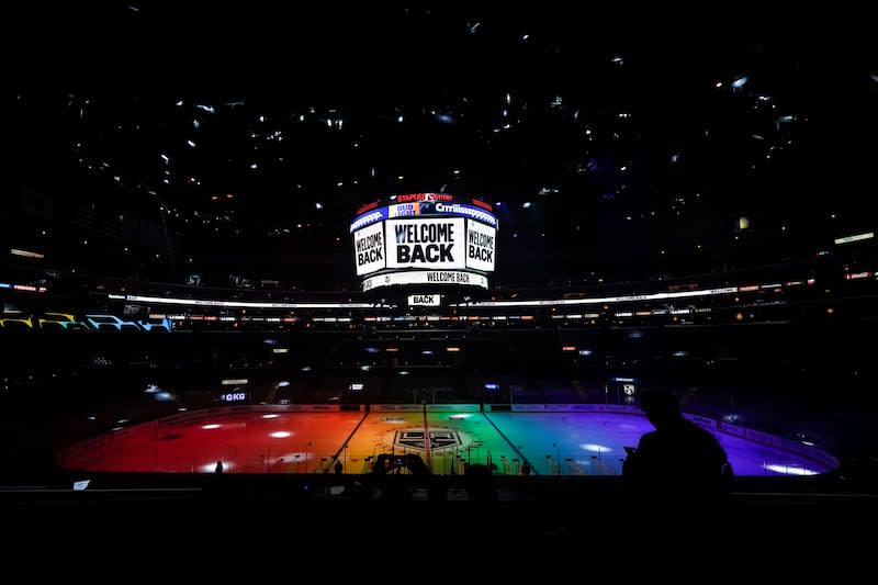 The ice is illuminated in rainbow light for Pride Night before an NHL hockey game between the Anaheim Ducks and the Los Angeles Kings, Monday, April 26, 2021, in Los Angeles.  |  Ashley Landis