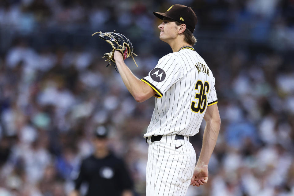 San Diego Padres starting pitcher Adam Mazur grimaces after giving up a two-run home run to Milwaukee Brewers' Willy Adames during the fifth inning of a baseball game Thursday, June 20, 2024, in San Diego. (AP Photo/Derrick Tuskan)