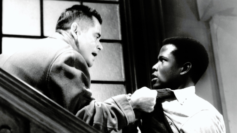 Image: Glenn Ford & Sidney Poitier in The Blackboard Jungle, 1955. Courtesy of Everett Collection.