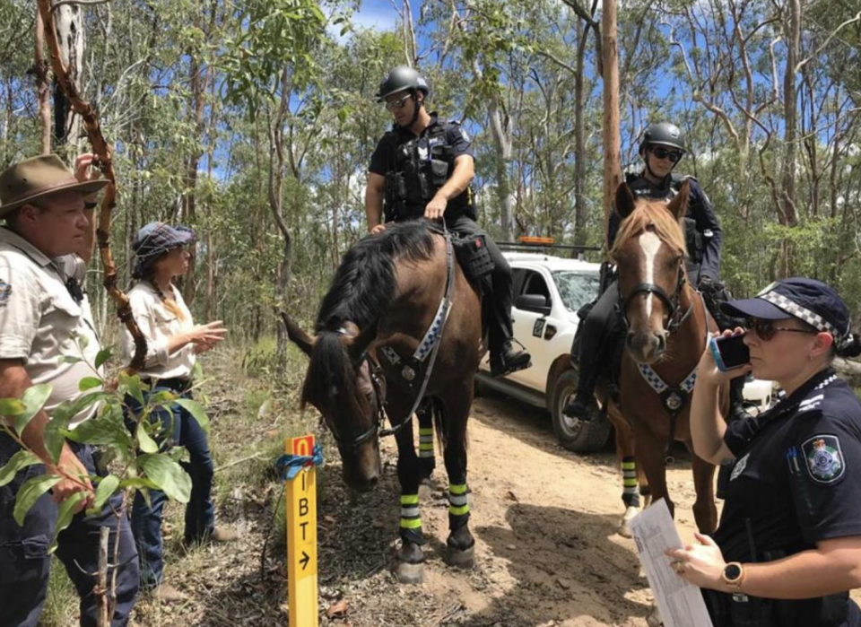 Council workers and mounted police attend White Rock. 