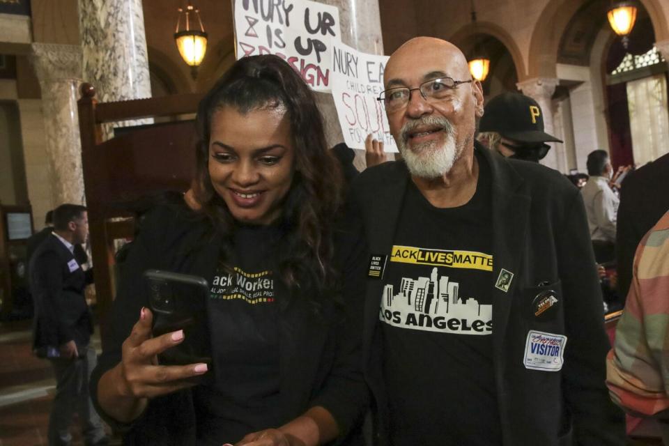 Pastor Thembekila Coleman-Smart, left, and activist Greg Akili