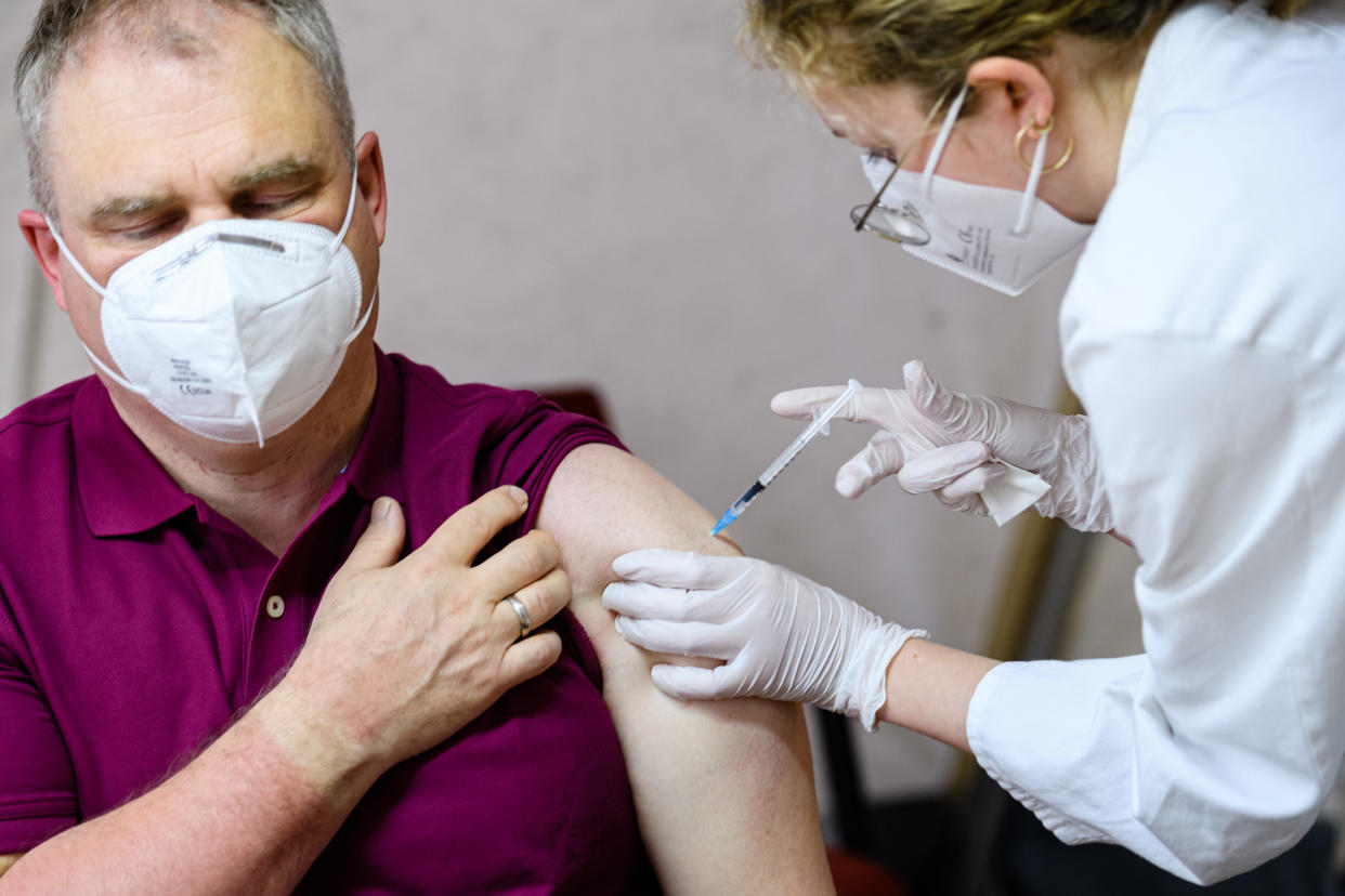 LEIPZIG, GERMANY - MAY 10: A doctor inoculates a patient with the Pfizer/BioNTech vaccine against Covid-19 at a mobile vaccination center in the Markkleeberg suburb town hall on May 10, 2021 in Leipzig, Germany. Germany has succeeded in accelerating its nationwide vaccinations in recent weeks. Approximately one third of the population has received a first dose. (Photo by Jens Schlueter/Getty Images)