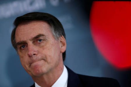 FILE PHOTO: Brazil's President-elect Jair Bolsonaro reacts as he speaks to media at the Army Headquarters in Brasilia, Brazil December 5, 2018. REUTERS/Adriano Machado