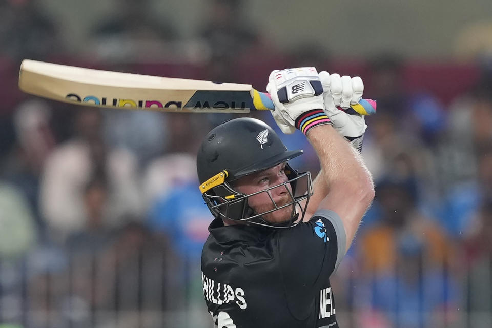 Glenn Phillips hits a six during the ICC Cricket World Cup match between Afghanistan and New Zealand in Chennai, India, Wednesday, Oct. 18, 2023. (AP Photo/Eranga Jayawardena)