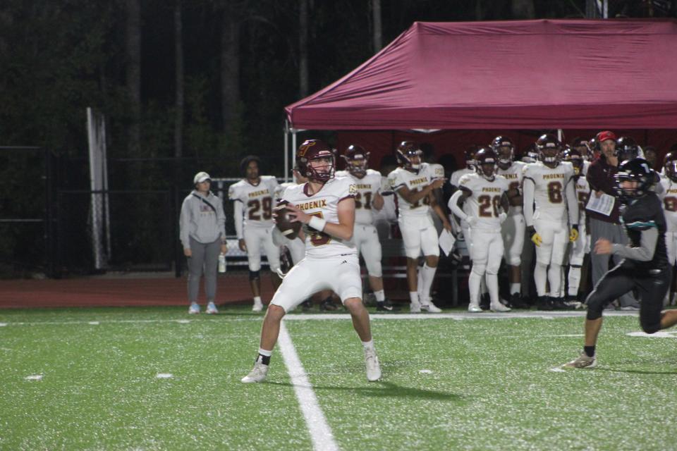 New Hampstead's Pauly Seeley looks for an open receiver against Islands on Thursday night.