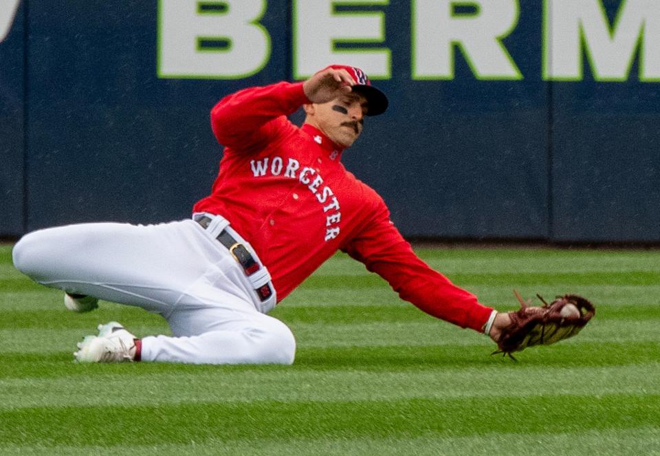 WooSox right fielder Mark Contreras makes a sliding catch to retire Buffalo’s Leo Jimenez in the eighth inning during Tuesday's home opener.