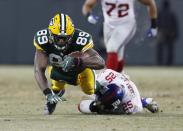 <p>Green Bay Packers tight end Jared Cook (89) is tackled by New York Giants defensive back Leon Hall (25) during the first half in the NFC Wild Card playoff football game at Lambeau Field. Mandatory Credit: Jeff Hanisch-USA TODAY Sports </p>
