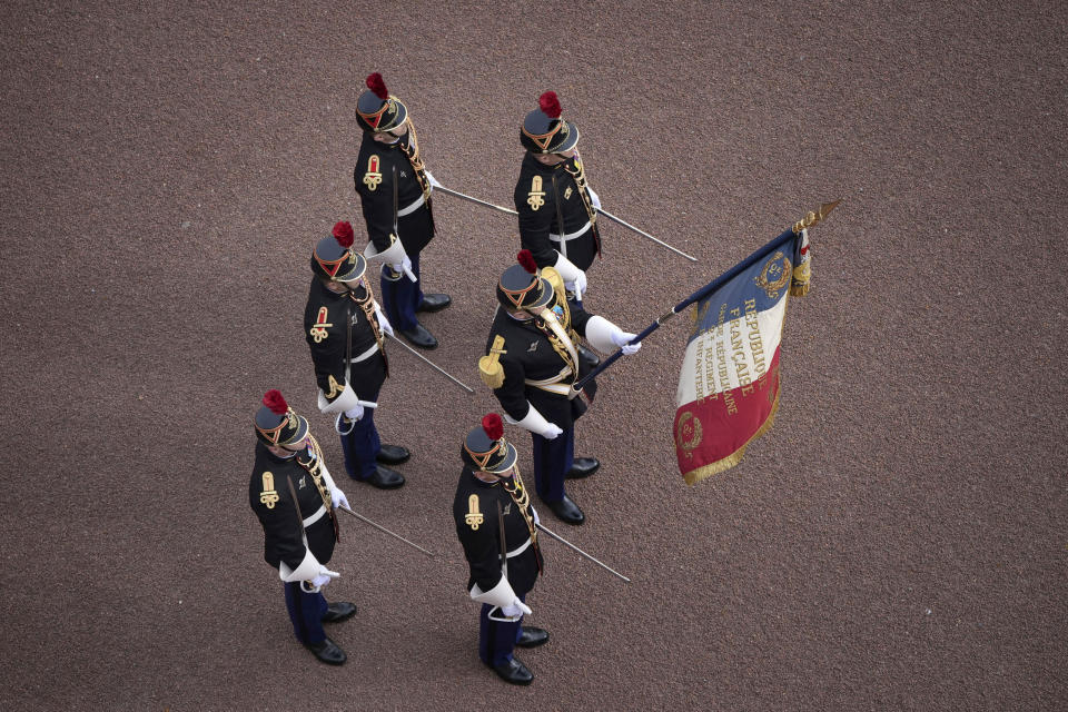 Troops from France's 1er Regiment de le Garde Republicaine partake in the Changing of the Guard ceremony at Buckingham Palace, to commemorate the 120th anniversary of the Entente Cordiale - the historic diplomatic agreement between Britain and France which laid the groundwork for their collaboration in both world wars, in London, Monday, April 8, 2024. France is the first non-Commonwealth country to take part in the Changing of the Guard. (Aaron Chown/PA via AP)