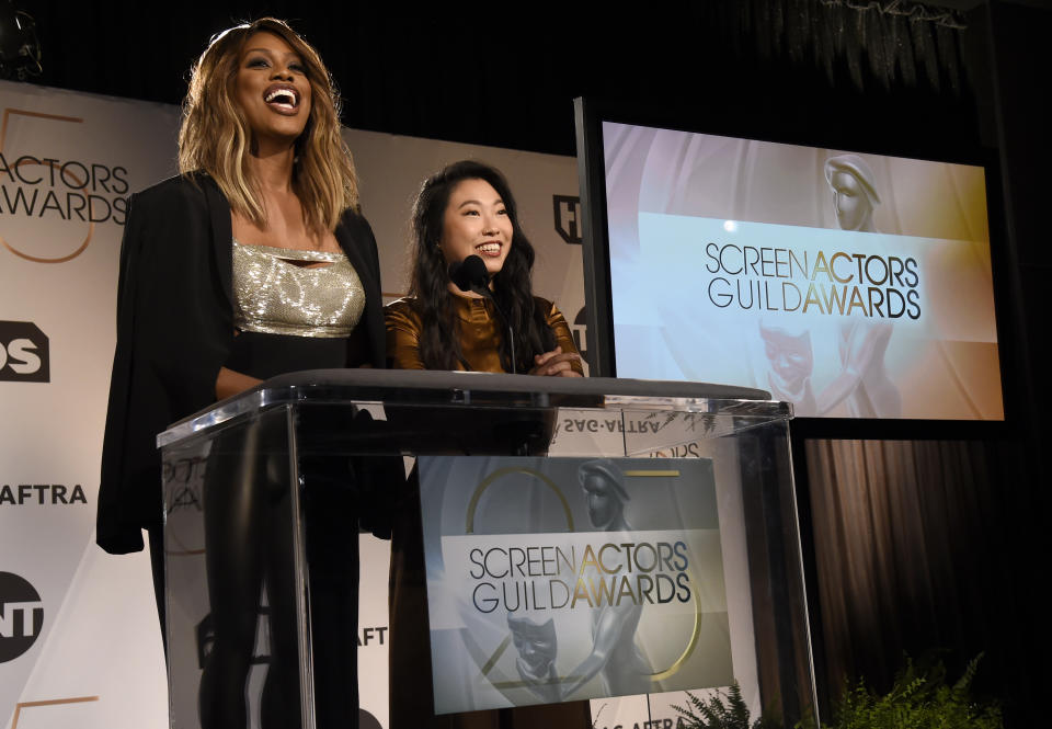 Presenters Laverne Cox, left, and Awkwafina announce nominations for the 25th annual Screen Actors Guild Awards at the Pacific Design Center on Wednesday, Dec. 12, 2018, in West Hollywood, Calif. The show will be held on Sunday, Jan. 27, 2019, in Los Angeles. (Photo by Chris Pizzello/Invision/AP)