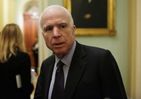 FILE PHOTO: Senator John McCain (R-AZ) speaks to reporters after the Senate voted to remove the filibuster rule for Supreme Court nominees, on Capitol Hill in Washington, U.S., April 6, 2017. REUTERS/Joshua Roberts/File Photo