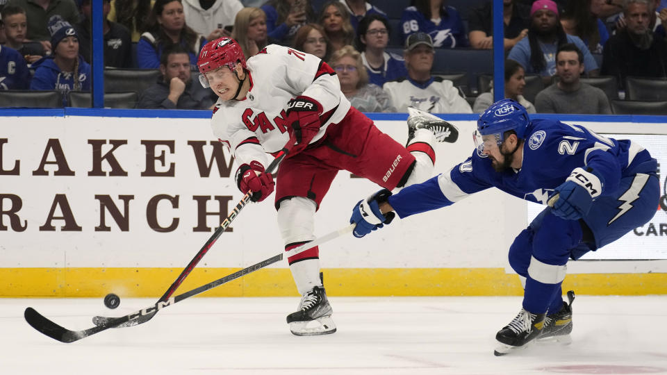 Tampa Bay Lightning left wing Nicholas Paul blocks a shot by Carolina Hurricanes right wing Jesper Fast (71) during the first period of an NHL hockey game Tuesday, Oct. 24, 2023, in Tampa, Fla. (AP Photo/Chris O'Meara)