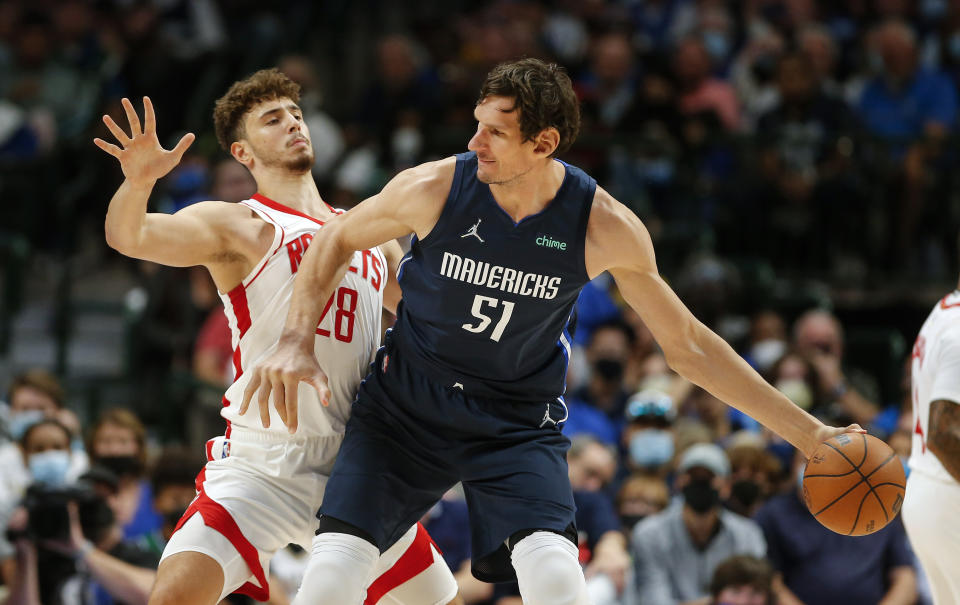 Dallas Mavericks forward Boban Marjanovic (51) battles Houston Rockets forward Alperen Sengun (28) for space during the second half of an NBA basketball game, Tuesday, Oct. 26, 2021, in Dallas. Dallas won 116-106. (AP Photo/Brandon Wade)