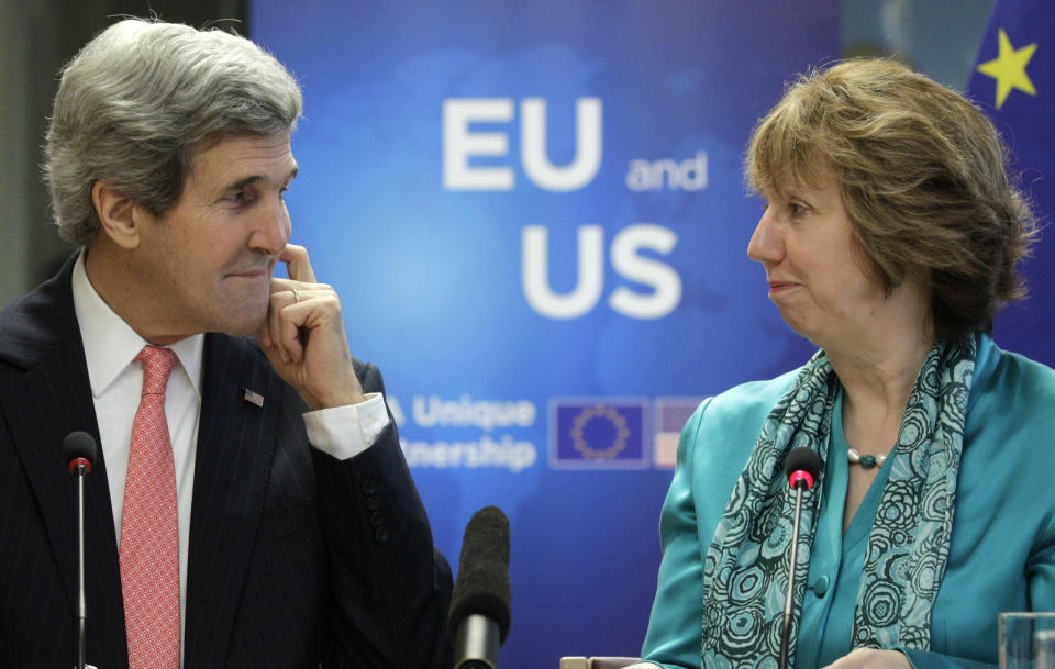 EU foreign policy chief Catherine Ashton, right, and U.S. Secretary of State John Kerry look at each other at the European External Action Service headquarters in Brussels on Wednesday April 2, 2014. Kerry met with Ashton and leading EU officials to discuss the dependency of the 28-nation bloc on Russian energy provisions and seek ways for a better diversification of oil and gas imports in the wake of the Crimean crisis. (AP Photo/Yves Logghe)