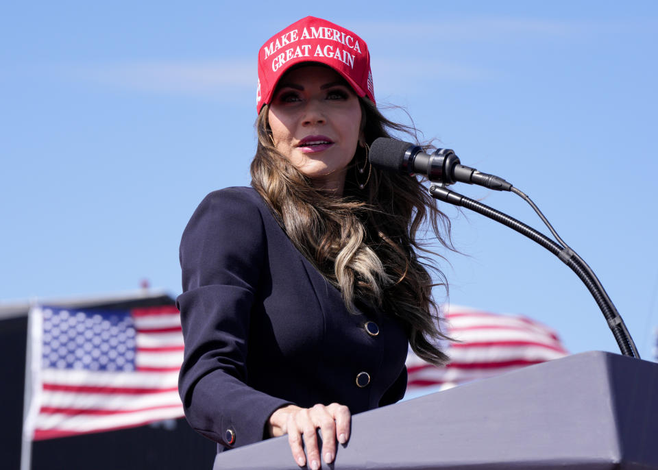 FILE - South Dakota Gov. Kristi Noem speaks prior to remarks from Republican presidential candidate and former President Donald Trump at a campaign rally, March 16, 2024, in Vandalia, Ohio. South Dakota may be best known for Noem’s no-apologies approach to politics, earning her the favor of former President Donald Trump. On Tuesday, voters will decide what a Republican majority in the South Dakota legislature looks like. (AP Photo/Jeff Dean, File)