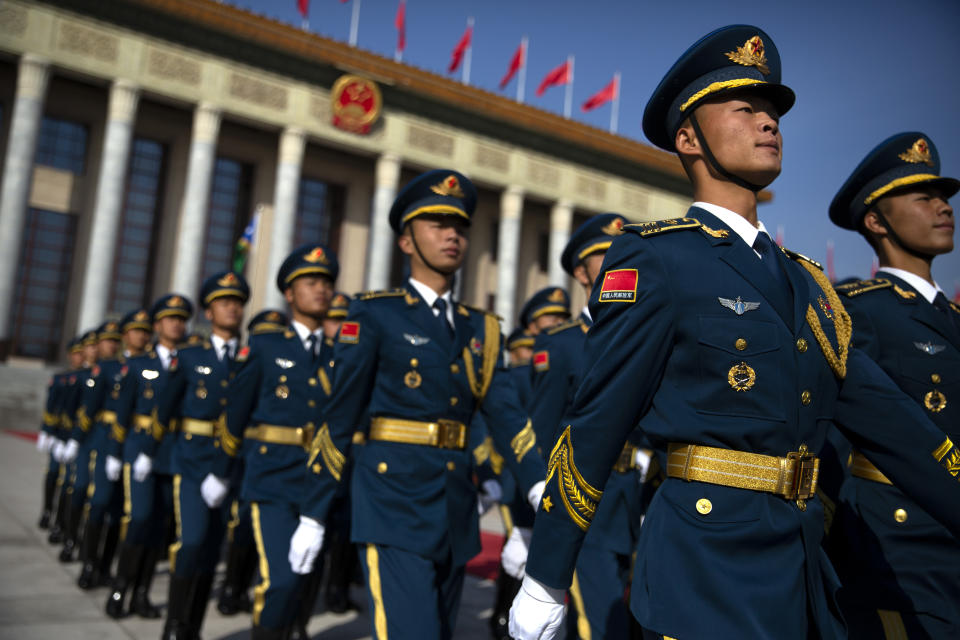 FILE - Members of a Chinese honor guard march in formation before a welcome ceremony for Solomon Islands Prime Minister Manasseh Sogavare at the Great Hall of the People in Beijing, Wednesday, Oct. 9, 2019. China wants 10 small Pacific nations to endorse a sweeping agreement covering everything from security to fisheries in what one leader warns is a “game-changing” bid by Beijing to wrest control of the region. (AP Photo/Mark Schiefelbein, File)