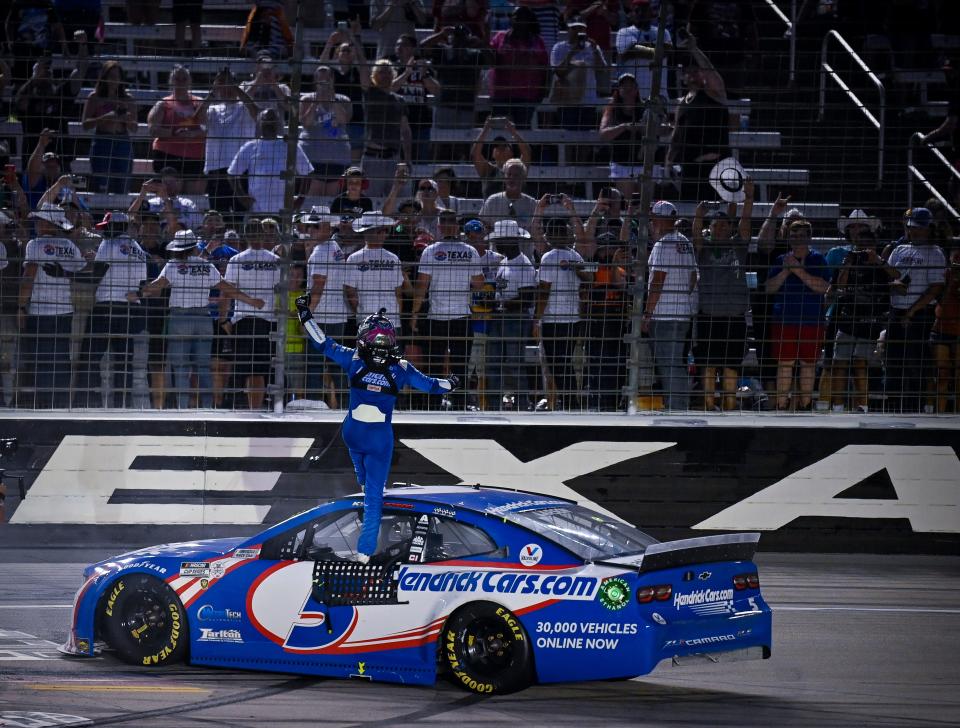 Kyle Larson celebrates winning the 2021 NASCAR All-Star Race at Texas Motor Speedway.