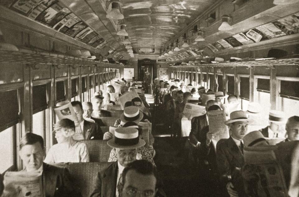 <p>A railcar makes the morning commute in New York City, as passengers read newspapers and gaze out the window.</p>