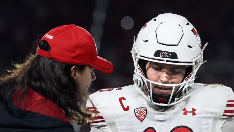 Utah Utes quarterback Cam Rising speaks to Bryson Barnes after Barnes threw an interception in the second half of the game against the USC Trojans at the Los Angeles Memorial Coliseum on Saturday, Oct. 21, 2023.