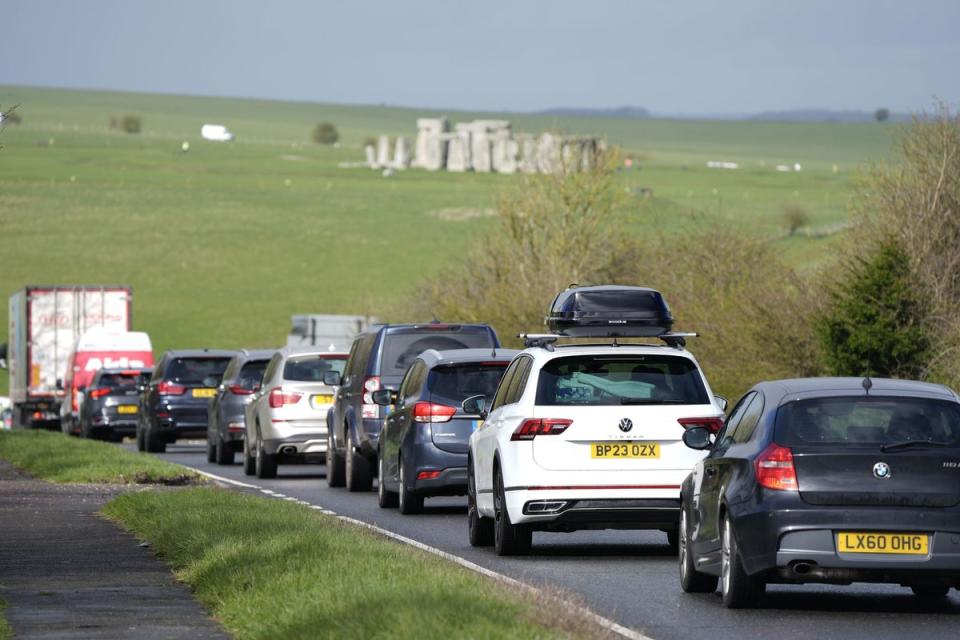 Cars make their way along the A303 past Stonehenge in Wiltshire  (Andrew Matthews/PA Wire)