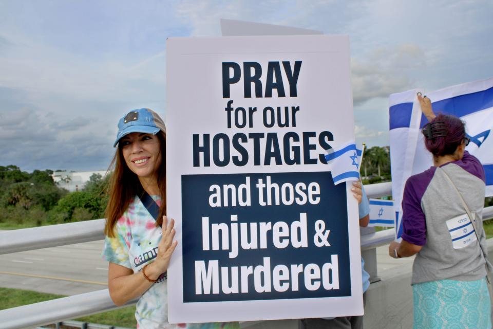 Jeanne Keival of North Palm Beach was one of about 30 people who rallied on the Hood Road overpass to Interstate 95 on Tuesday, Oct. 10, 2023, in support of Israel in its war with Hamas.
