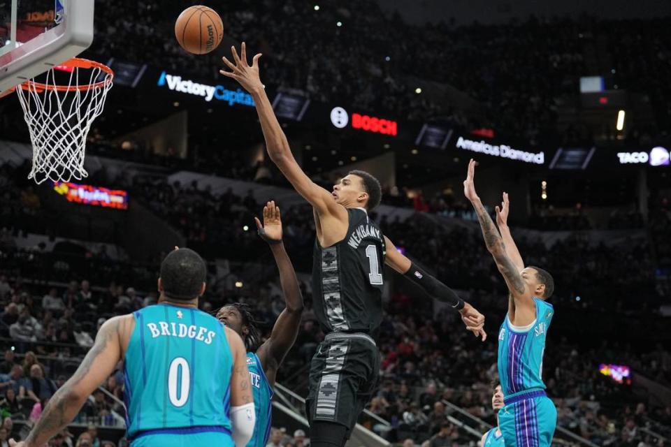 Victor Wembanyama (1) shoots over Charlotte Hornets forward Miles Bridges (0) in the second half at Frost Bank Center.