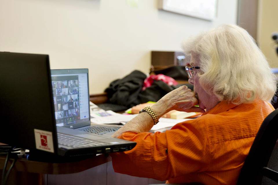 Trudy Berlin hosts her weekly Zoom session at the Levis Jewish Community Center in Boca Raton, Fla., Tuesday, March 16, 2021. During the coronavirus pandemic, Berlin moved her in-person classes to Zoom. She's grown a steady audience of about 50 women from the U.S. and Canada who have come to view the class as a support group. Berlin says it's "a whole new world out there" and she's having fun. (AP Photo/Cody Jackson)