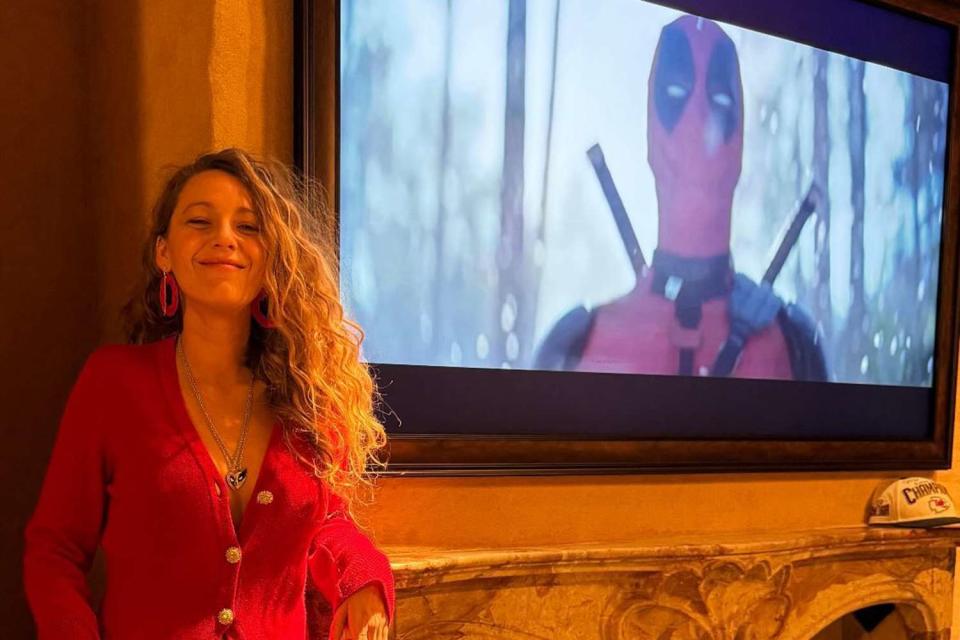 <p>blake lively/instagram</p> Blake Lively poses in front of Ryan Reynolds