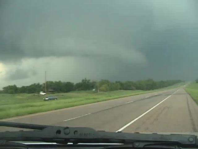 Storm spotter Dennie Bryson shot this video of a rain-wrapped tornado south of Stroud, Oklahoma May 20, 2013.