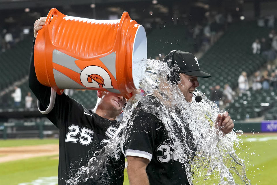 Chicago White Sox's Andrew Vaughn (25) dumps water onto Gavin Sheets after the team's 8-3 win over the Cleveland Guardians in a baseball game Tuesday, May 16, 2023, in Chicago. (AP Photo/Charles Rex Arbogast)