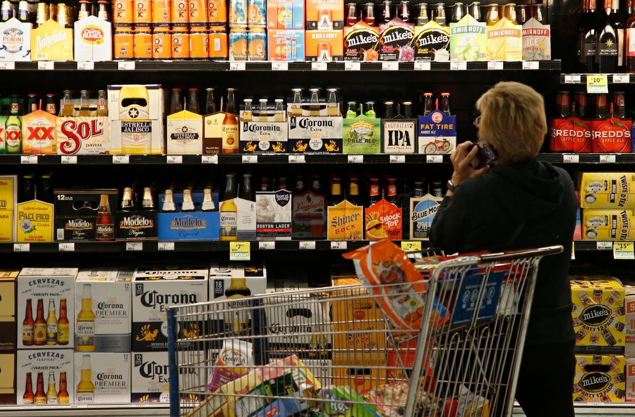 A customer looks over the beer selection at Crest Foods in Oklahoma City.