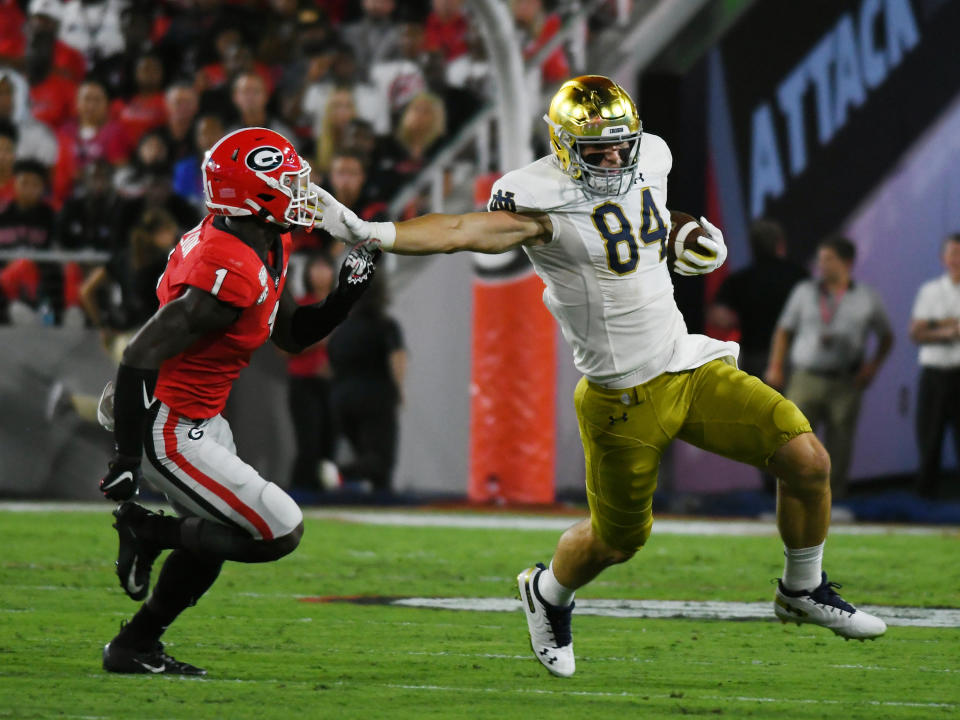 Notre Dame TE Cole Kmet, right, mostly was terrific in his 2019 season debut. (Getty Images)