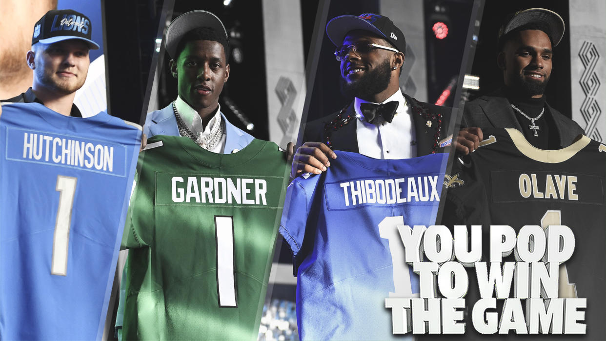 First round picks Aidan Hutchinson, Sauce Gardner, Kayvon Thibodeaux & Chris Olave smile with their jerseys after they were selected in the first round of Thursday night's NFL Draft. (Photos by David Becker/Getty Images)
