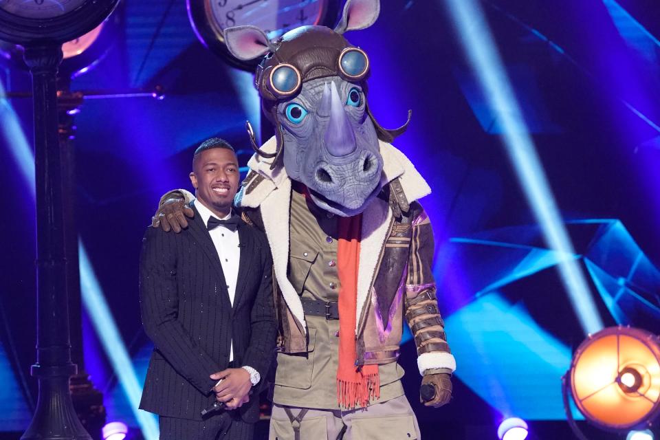 Host Nick Cannon and The Rhino on "The Masked Singer."