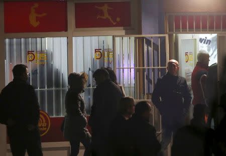 Forensic personnel are seen in front of a betting shop after attack in Sarajevo, November 19, 2015. REUTERS/Dado Ruvic