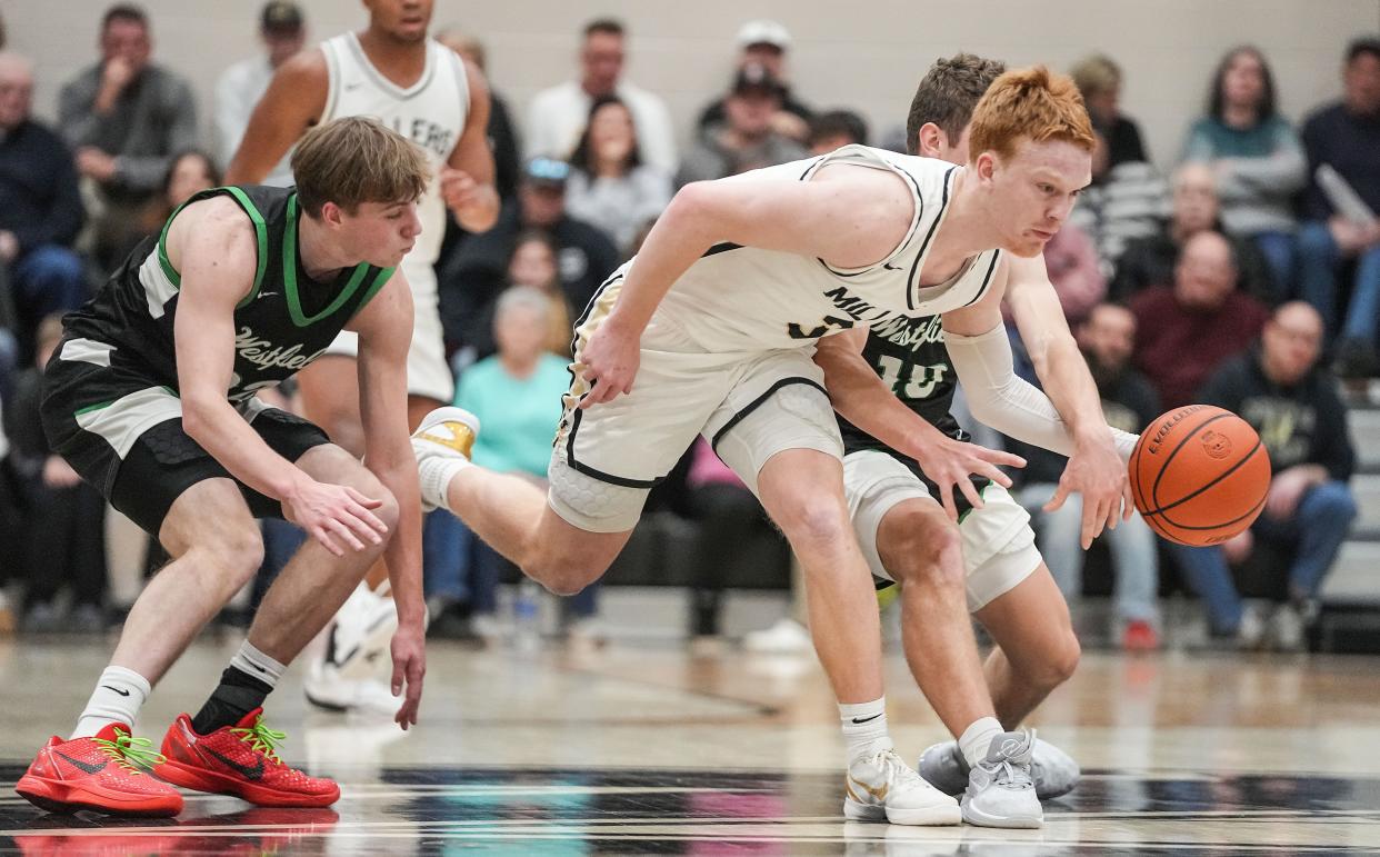 Noblesville Millers guard Aaron Fine (3) rushes after the ball Wednesday, Jan. 17, 2024, during the game at Noblesville High School in Noblesville. The Westfield Shamrocks defeated the Noblesville Millers, 58-54.