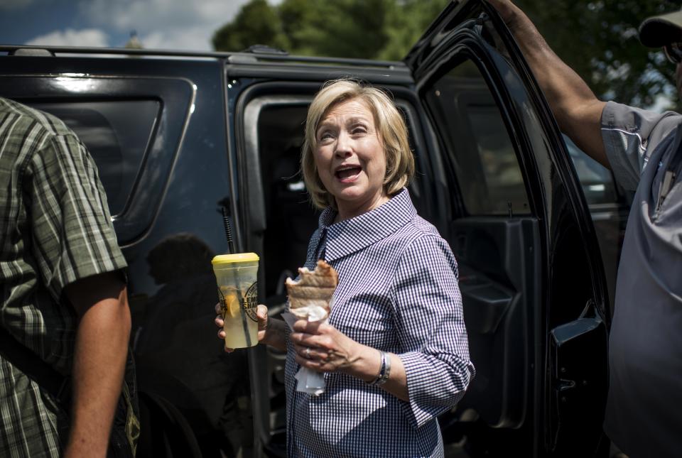 <p>Hillary Clinton enjoys a pork chop and lemonade.</p>