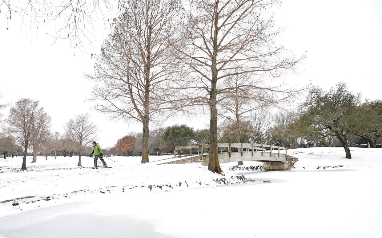 <p>File image: A skier glides along a golf course in Fort Worth, Texas. Winter storm Uri has brought historic cold weather and power outages to the state</p> (Getty Images)