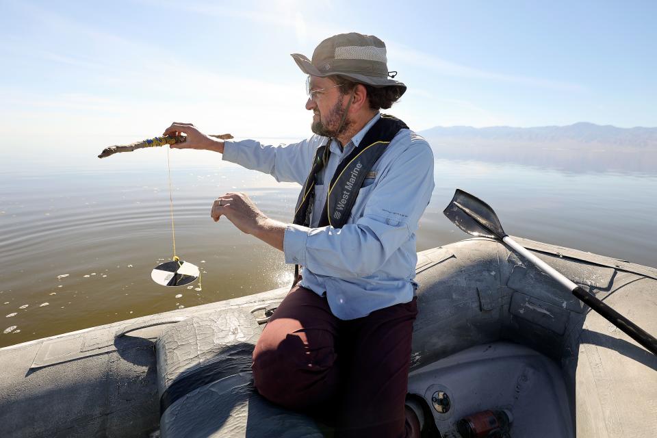 Ryan G. Sinclair, Loma Linda University associate professor of public health and earth and biological sciences, uses a Secchi disk to measure water clarity in the Salton Sea, Calif., on Thursday, Dec. 14, 2023. | Kristin Murphy, Deseret News