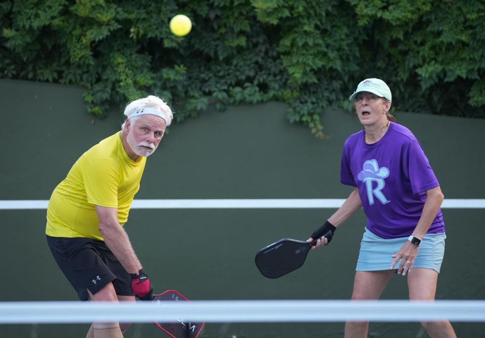 Dan and Darlene Byrne play pickleball at a house in Rollingwood on Thursday June 29, 2023.  More than 50 people formed a private pickleball club that plays daily at locations in Westlake, Rollingwood and Bee Cave.