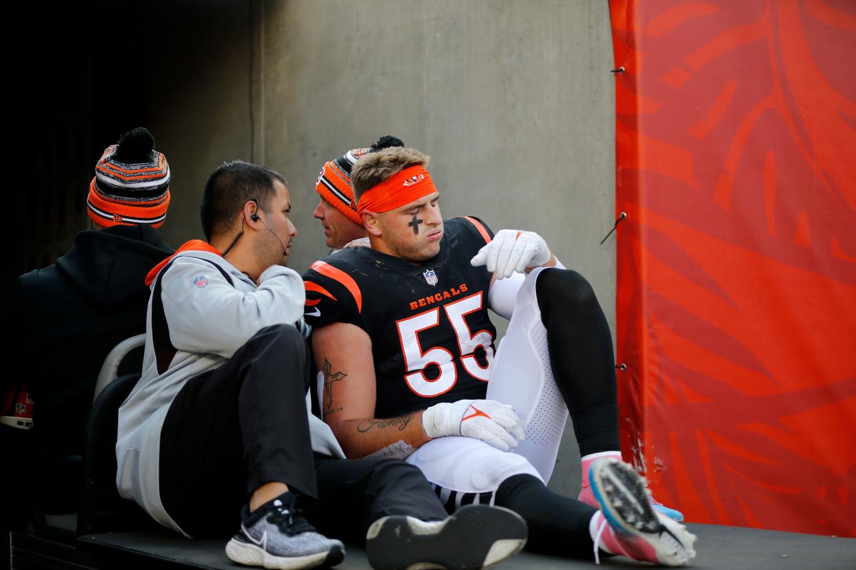 Cincinnati Bengals linebacker Logan Wilson (55) is carted to the locker room with an injury in the second quarter of the NFL Week 13 game between the Cincinnati Bengals and the Los Angeles Chargers at Paul Brown Stadium in Cincinnati on Sunday, Dec. 5, 2021. The Chargers led 24-13 at halftime. 