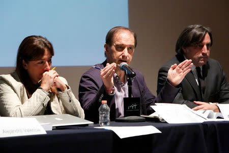 Members of the Inter-American Commission on Human Rights (IACHR) Carlos Beristain (C), Angela Buitrago (L) and Francisco Cox, attend a news conference on the disappearance of the 43 students at Ayotzinapa teacher training college, in Mexico City, Mexico, April 28, 2016. REUTERS/Ginnette Riquelme