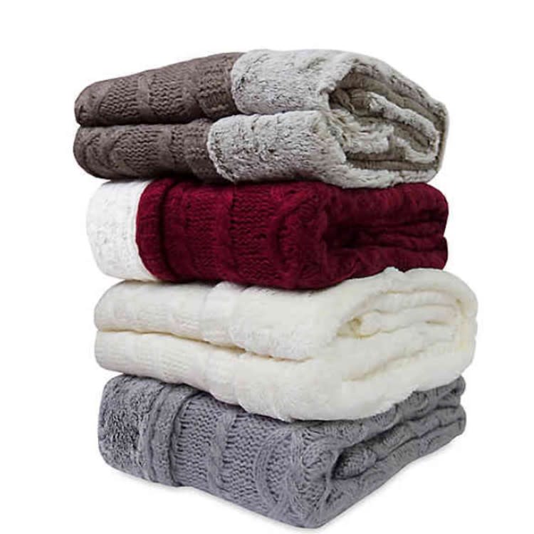 Keep warm and dress up your dorm with cozy throw blankets. (Photo: Bed Bath and Beyond)
