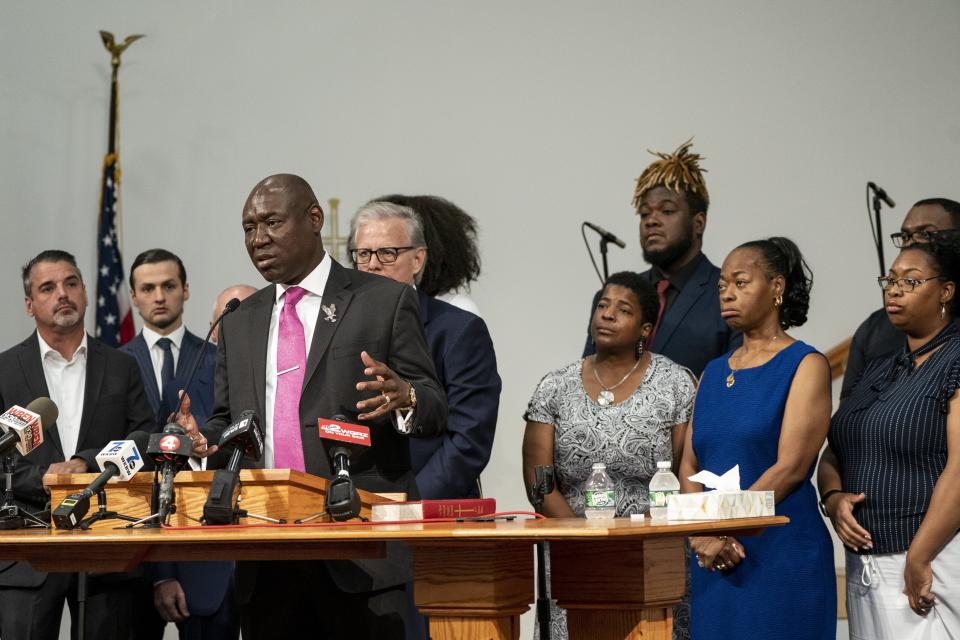 Attorney Ben Crump speaks, standing with families of the May 14 shooting victims and their attorneys, speaks during a press conference, Wednesday, July 12, 2023, in Buffalo, N.Y. Victims and relatives of last year's mass shooting at a Buffalo supermarket announced Wednesday they are suing the social media sites, weapons retailers and others who they say “loaded the gun” the assailant used to kill 10 Black people and wound three other victims in an attack fueled by racist conspiracy theories he encountered online. (Libby March/The Buffalo News via AP)