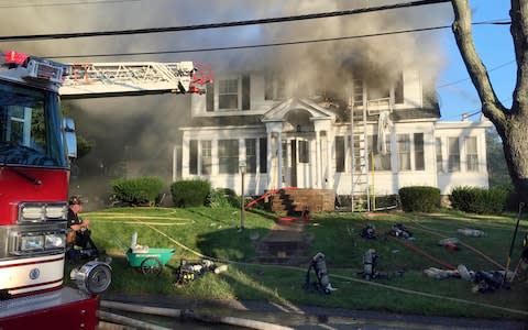 Firefighters battle another house on fire, on Herrick Road in North Andover - Credit: Mary Schwalm