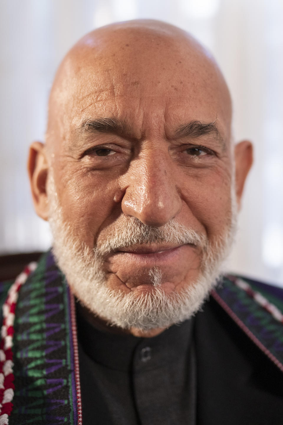 Former President of Afghanistan Hamid Karzai poses for a photo during an interview with the Associated Press in Kabul , Afghanistan, on Friday, Dec. 10, 2021. (AP Photo/Petros Giannakouris)