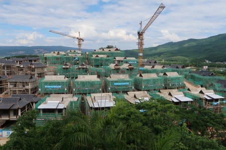 Villas of real estate property "Viva Villa" developed by Ping An Real Estate are seen under construction in Xishuangbanna, Yunnan